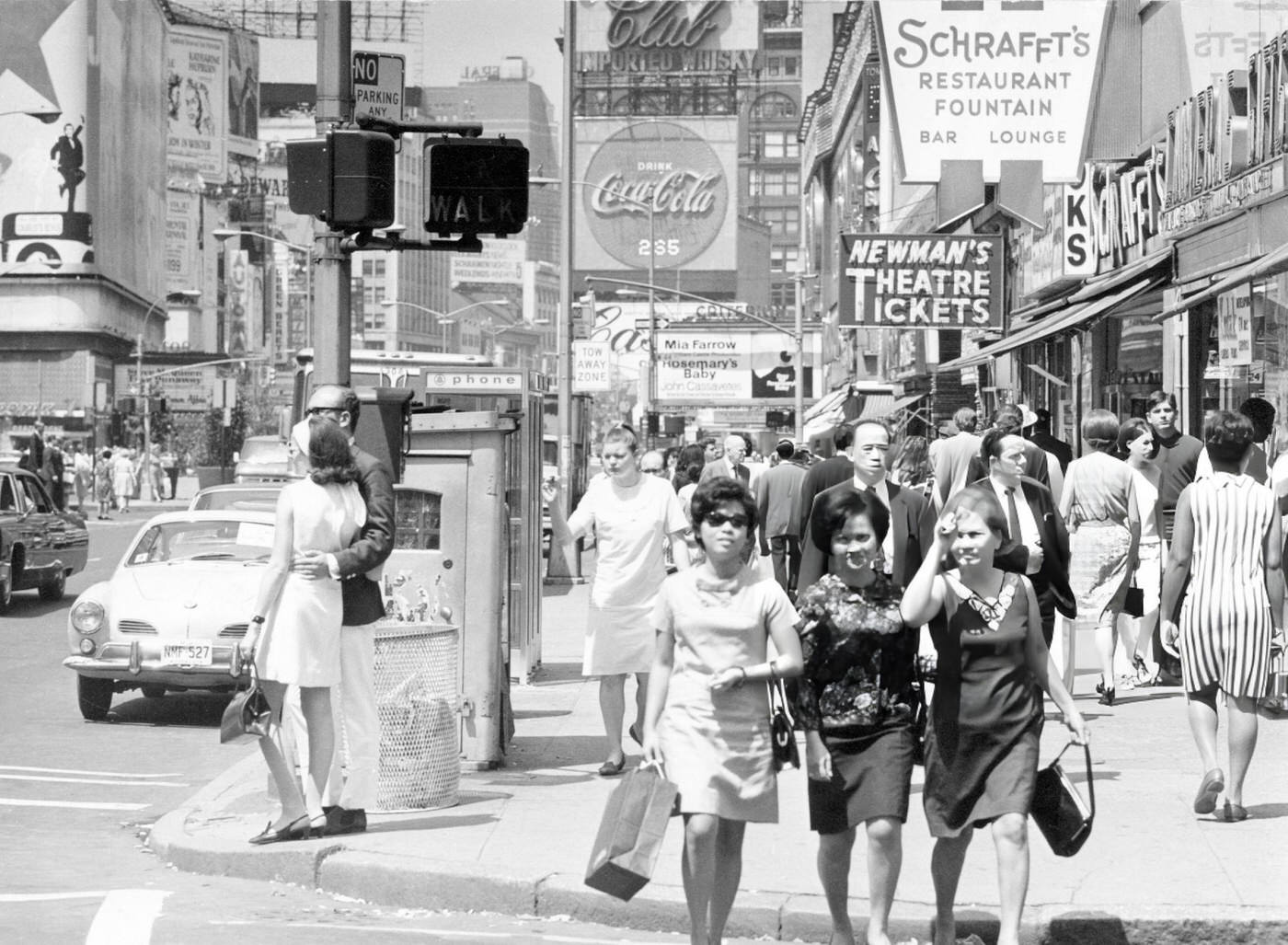 Street Scene In Times Square, Showing People Crossing The Street.