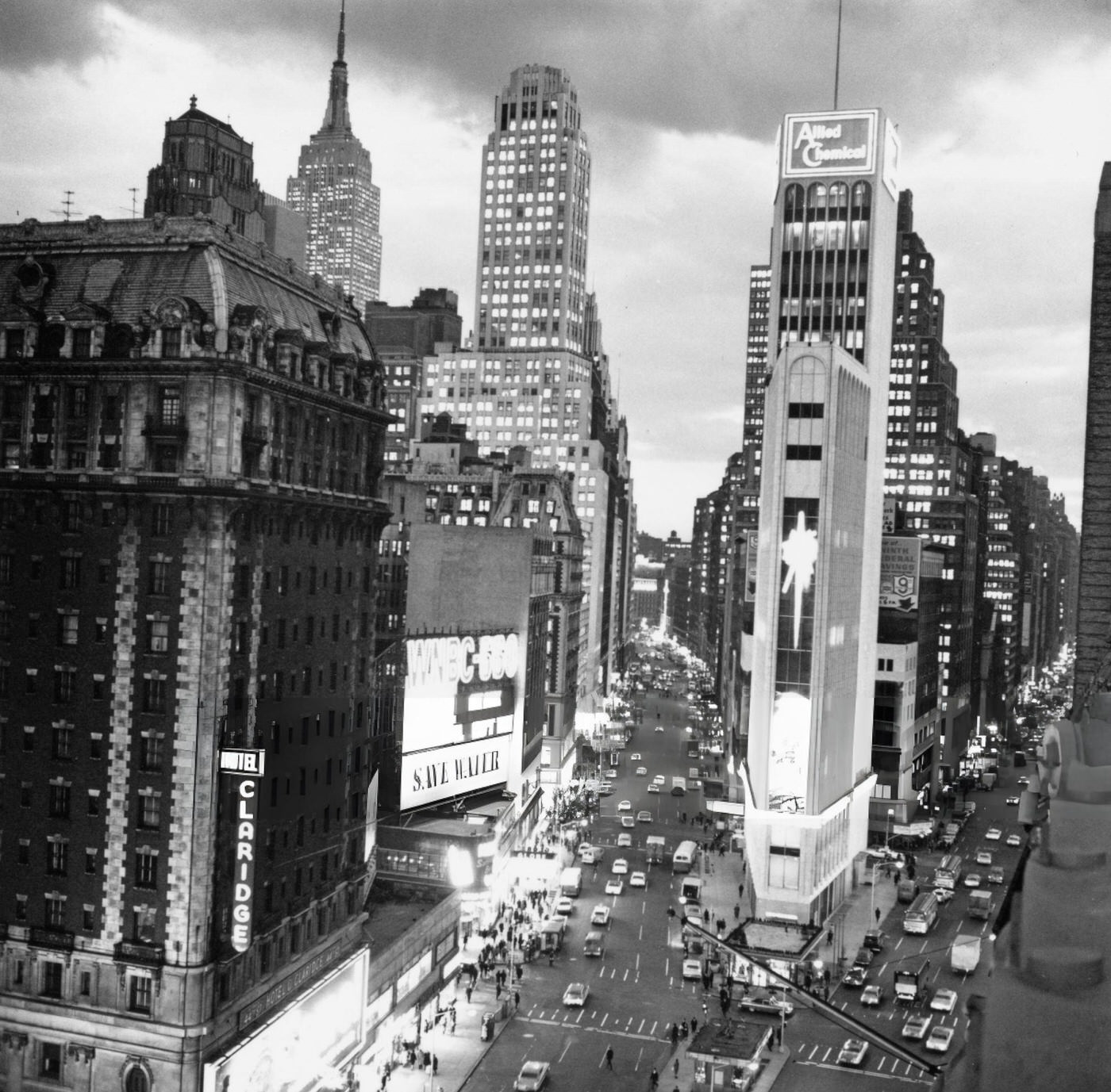 High-Angle View Of The Allied Chemicals Building Illuminated As Evening Falls Over Times Square, December 10, 1965.