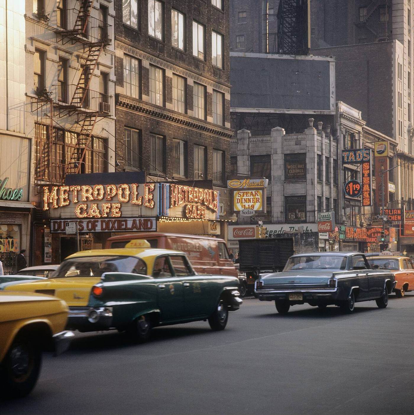 Street Scene With Cars And Taxis Driving On Broadway In Times Square, Showing The Metropole Cafe, 1964.