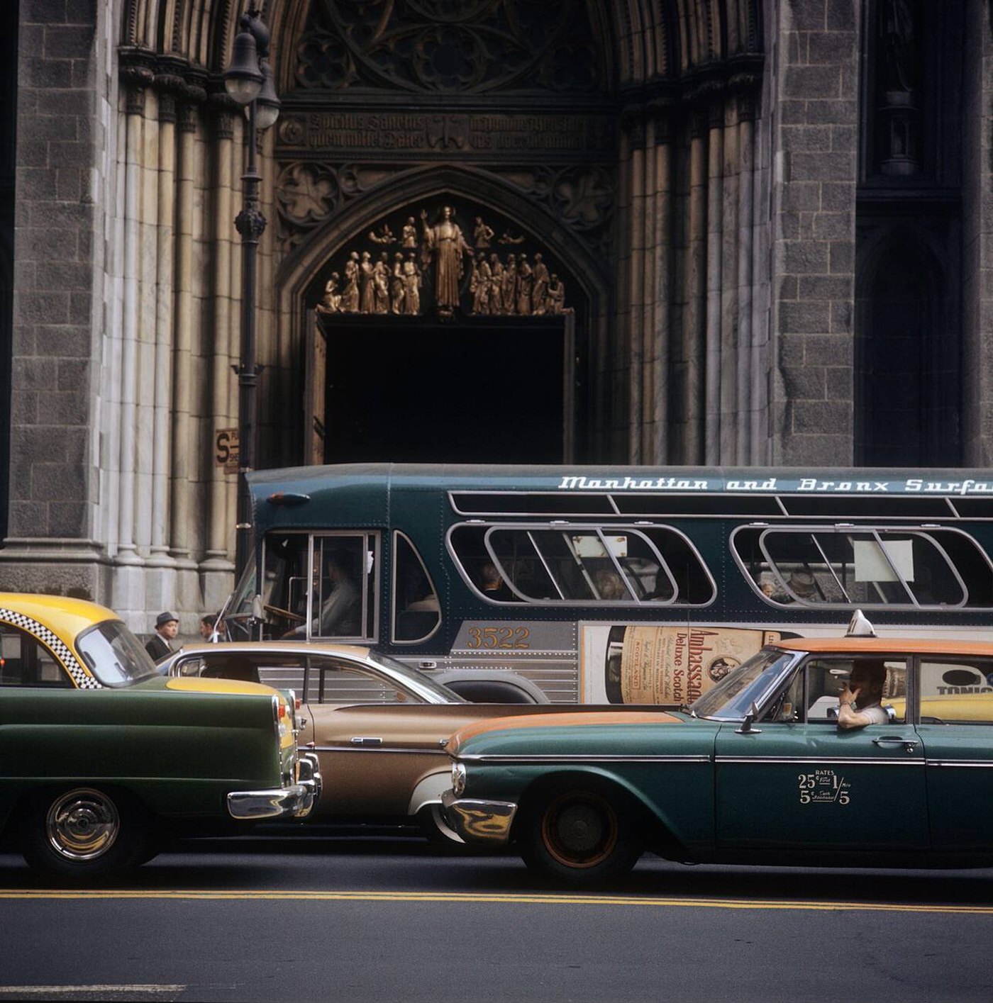Street Scene In Front Of A Church Entrance With Cars, Taxis And A Bus In Times Square, 1964.