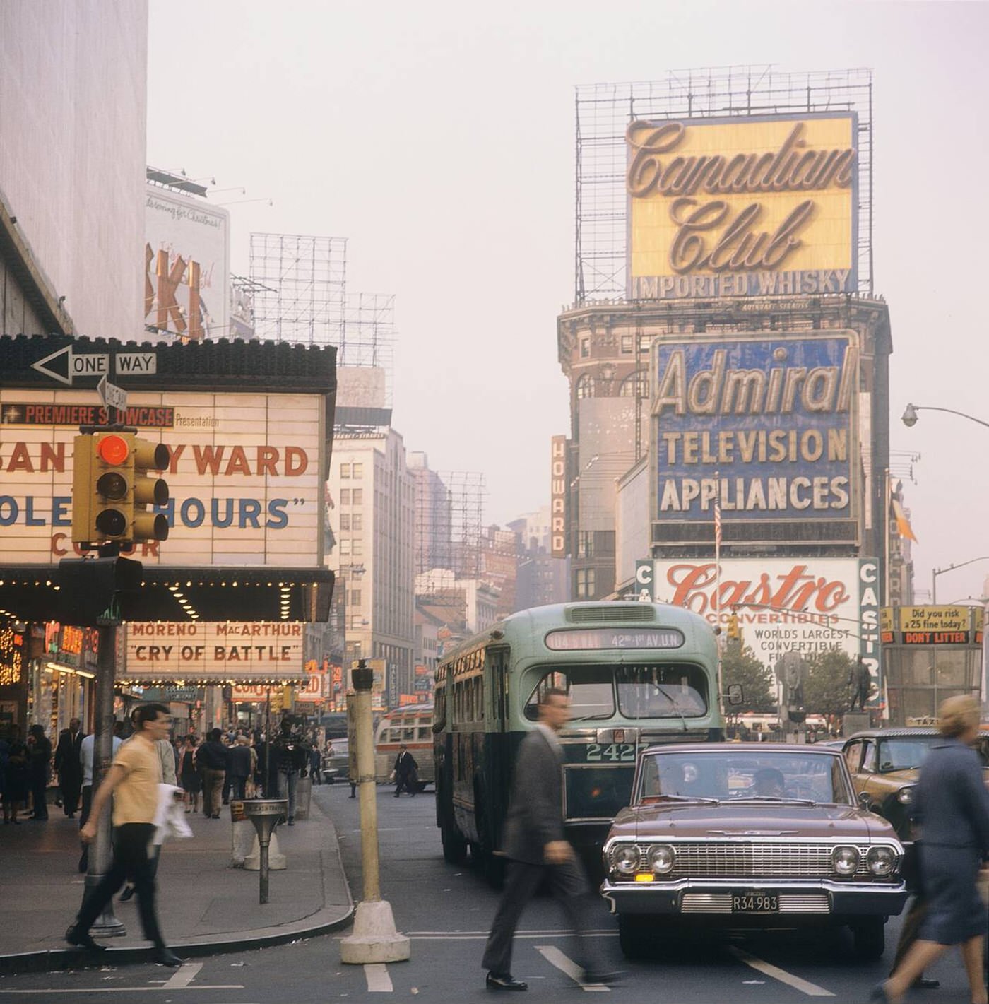 Street Scene With Cars, Buses And Taxis Driving On Broadway In Times Square, Showing Movie Theatres, 1964.