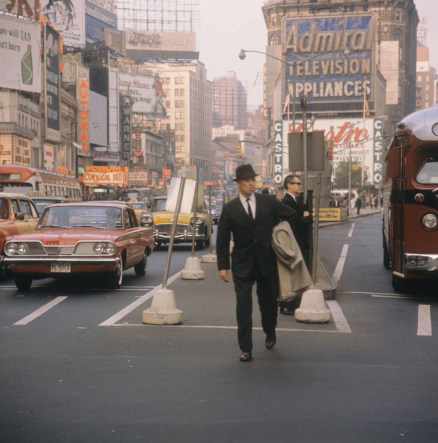 Street Scene With Cars, Buses And Taxis Driving On Broadway In Times Square, 1964.