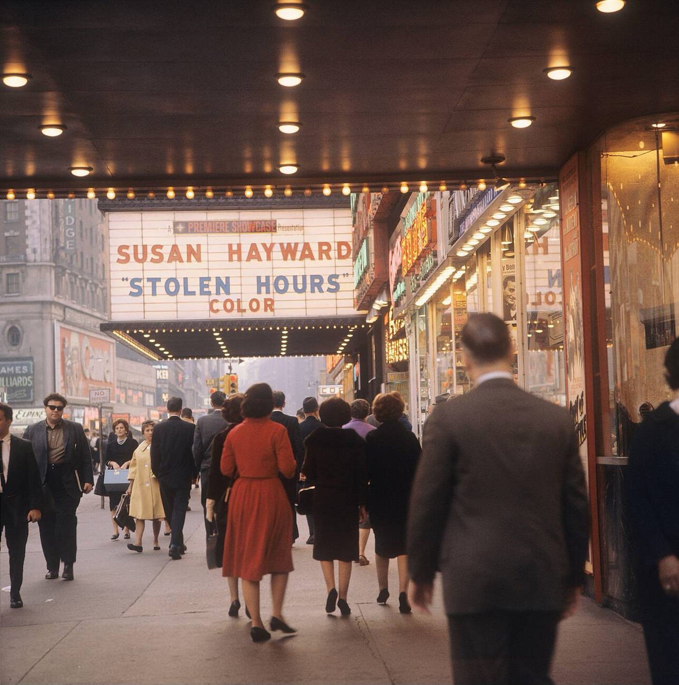 Street Scene On Broadway In Times Square, Showing The Sign Outside The Movie Theatre Promoting 'Stolen Hours', 1964.