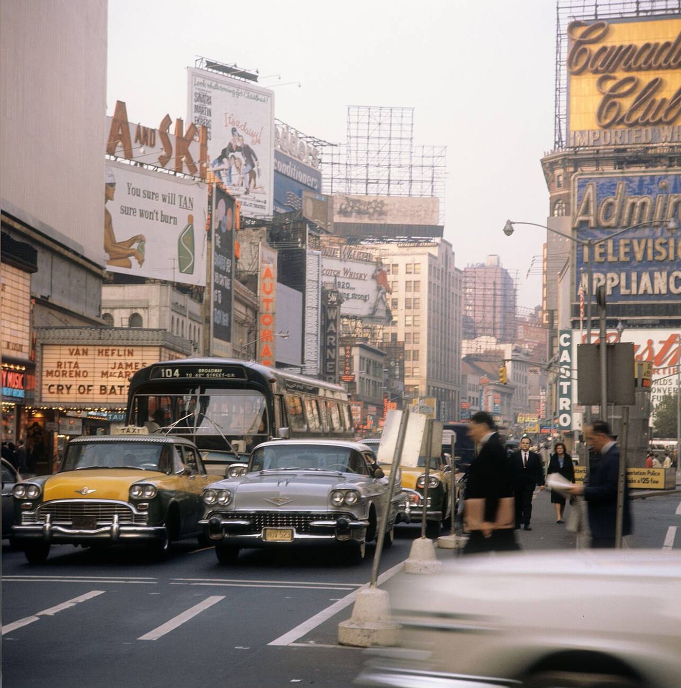 Street Scene With Cars, Buses And Taxis Driving On Broadway In Times Square, 1964.