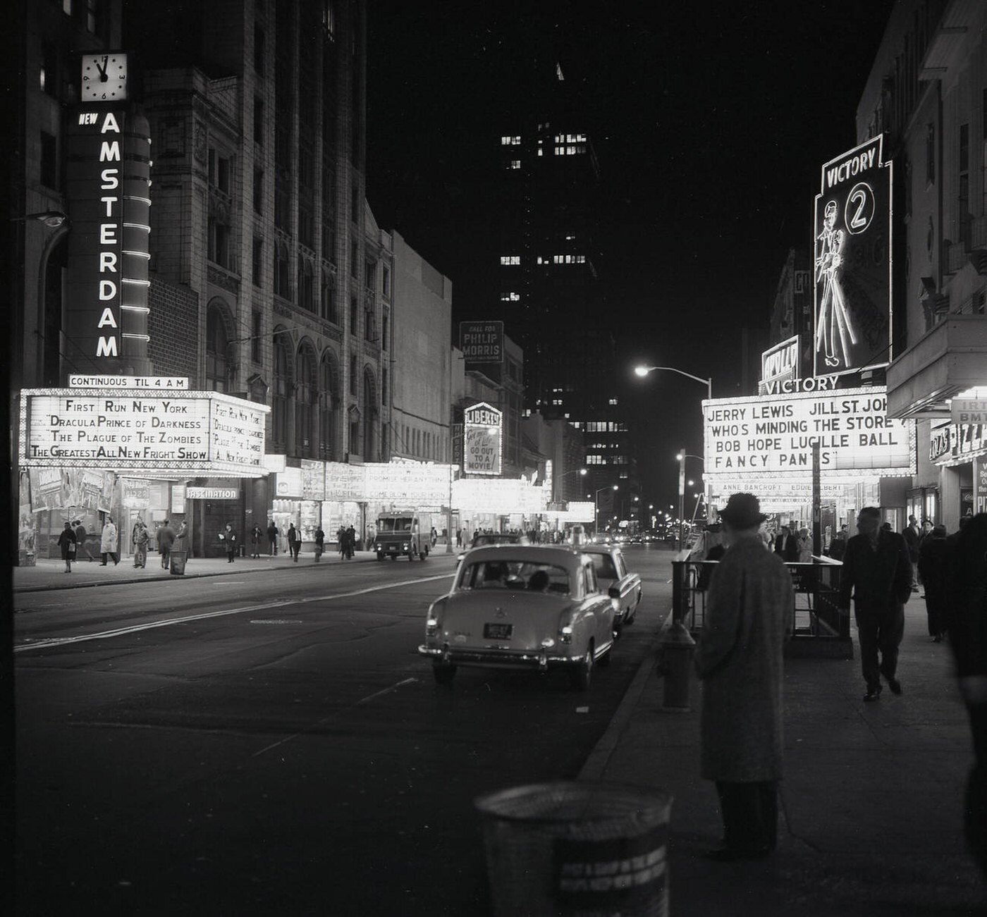 Evening Time At Broadway, Mid-Town Manhattan, Showing The Neon Lights Of Cinemas, Theatres, Shops And Bars In Times Square, 1965.