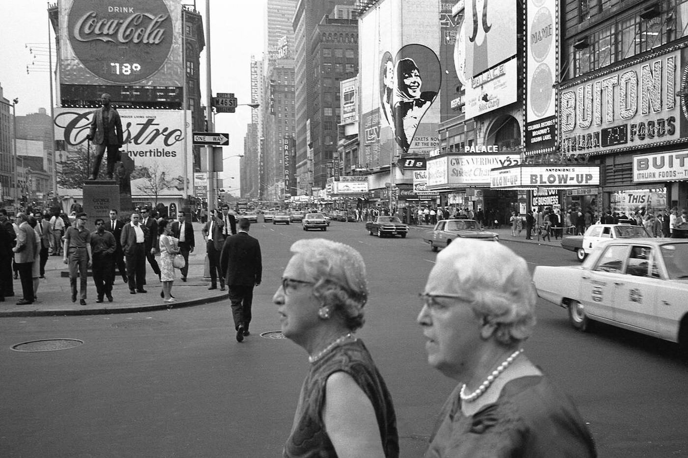 Two Older Women With Pearl Necklaces On The New York Times Square.