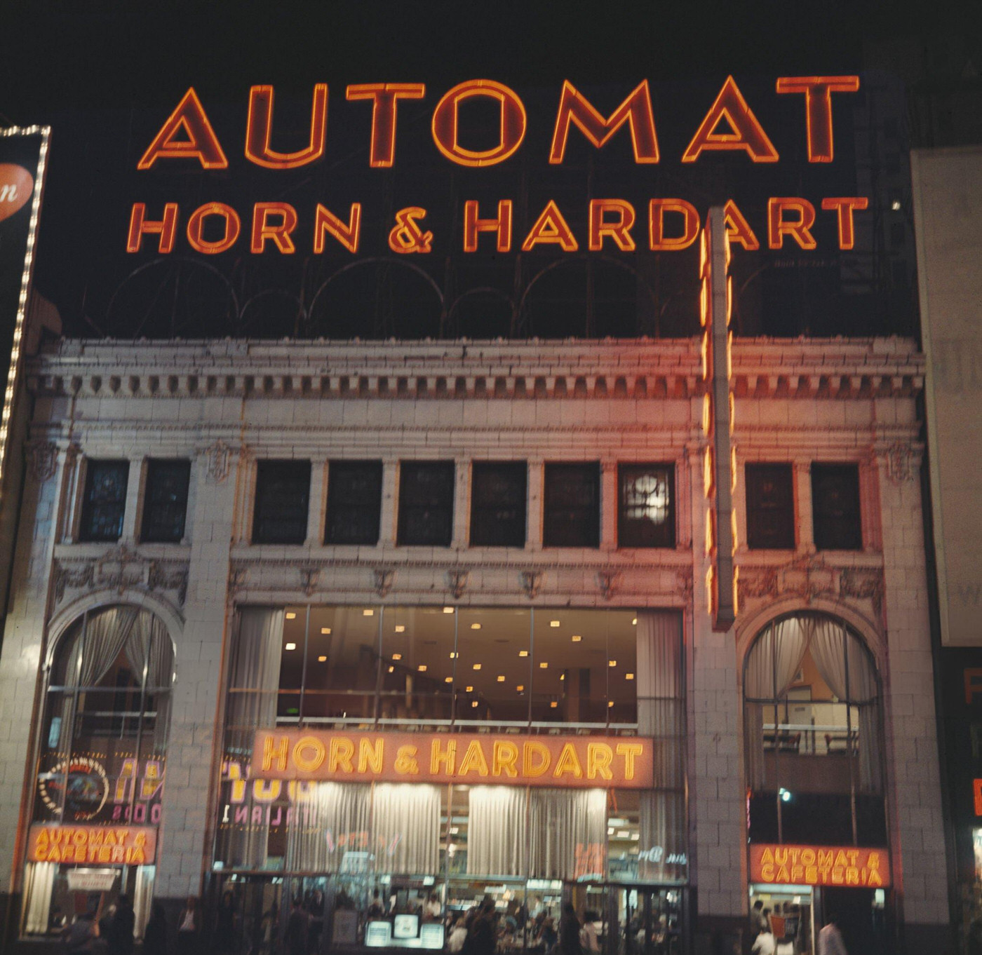 The Horn And Hardart Automat And Cafeteria On Times Square At Nighttime, Circa 1961.