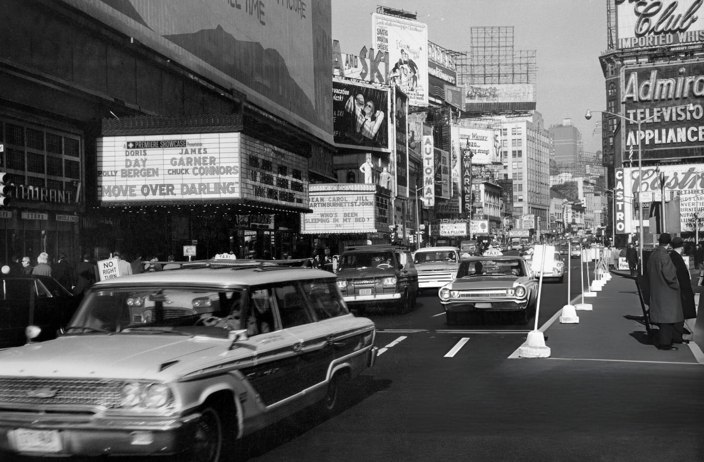 Cars Driving On Broadway At Times Square, With Commercial Signs And Theatre Marquees Advertising Films, 1963.