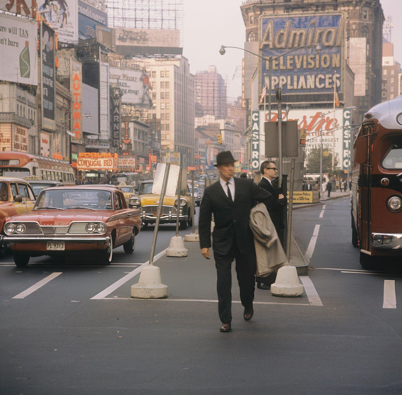A Street Scene With Cars, Buses And Taxis Driving On Broadway In Times Square, 1964.