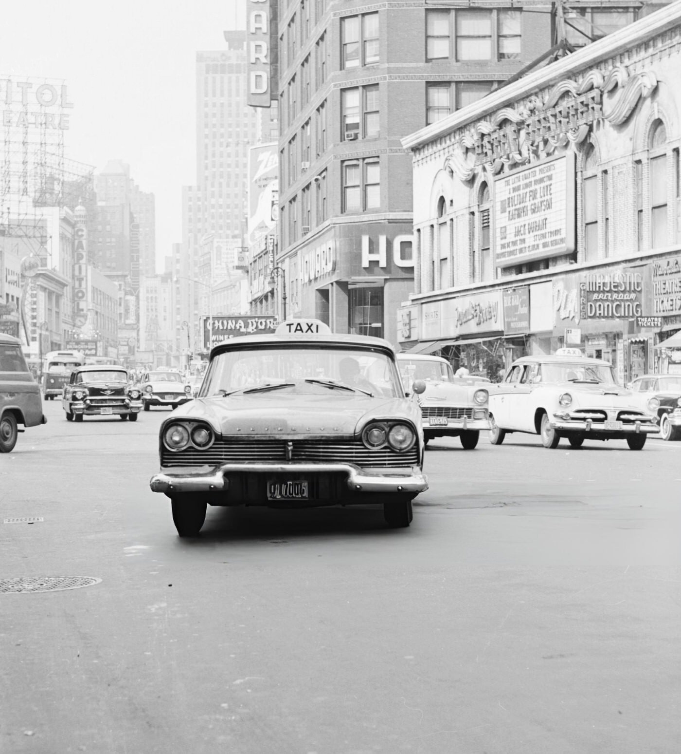 An American Taxi Cab In Times Square, Circa 1960.