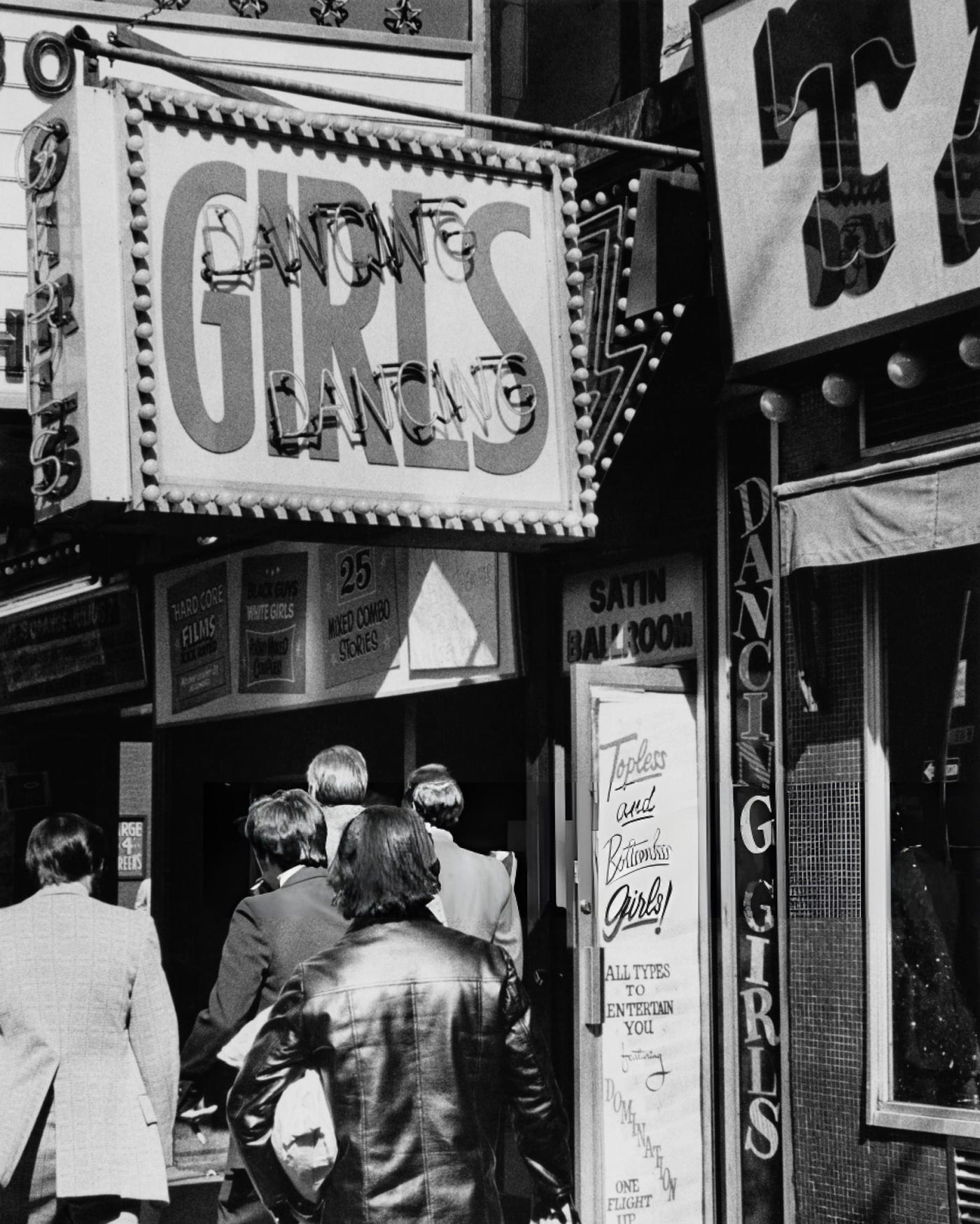 Two Men Wait To Cross The Street At The Intersection Of West 43Rd Street And Broadway In Times Square, June 1, 1963.