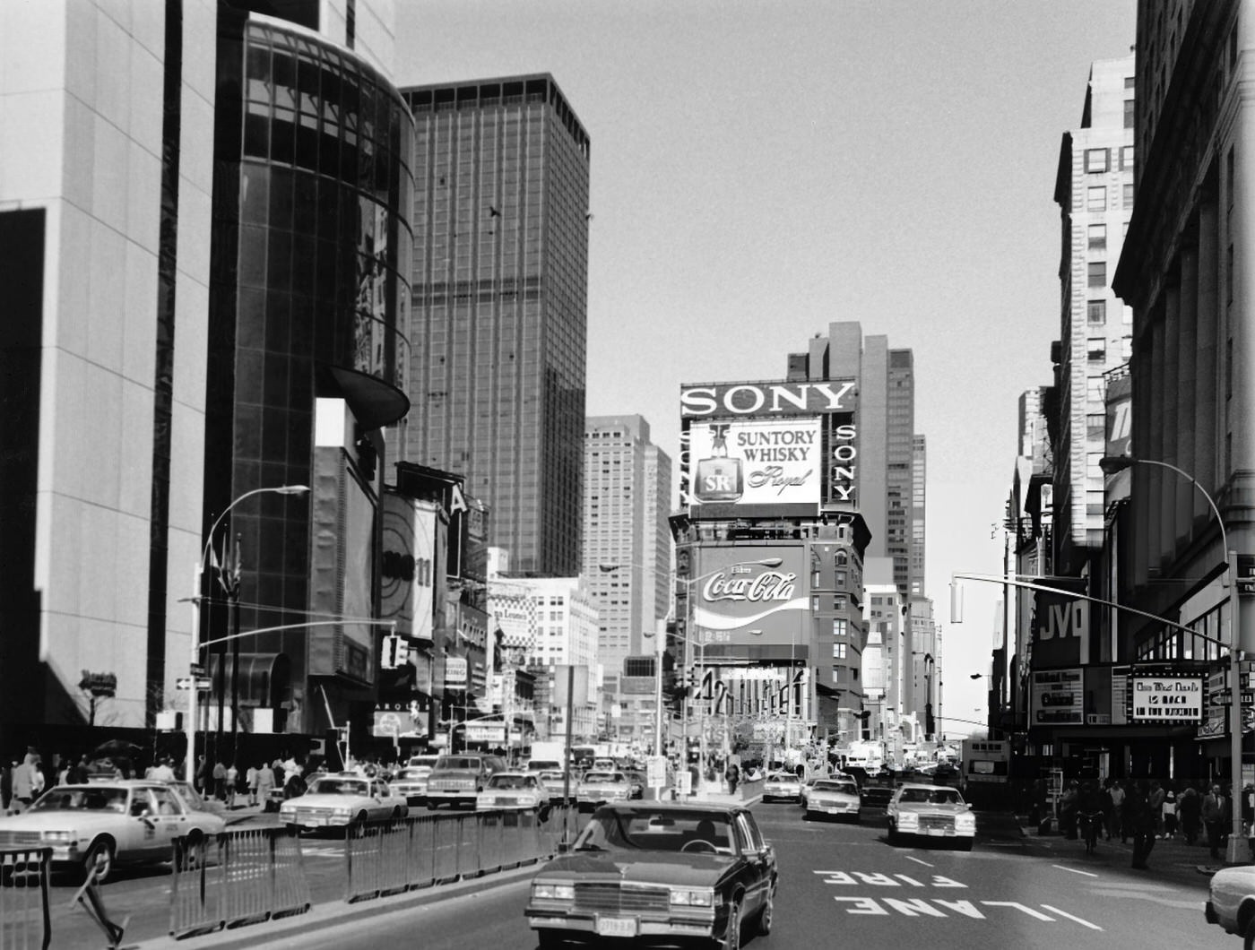 Cars Driving At Times Square, With Billboards For Sony, Suntory Whisky And Coca-Cola, 1987.