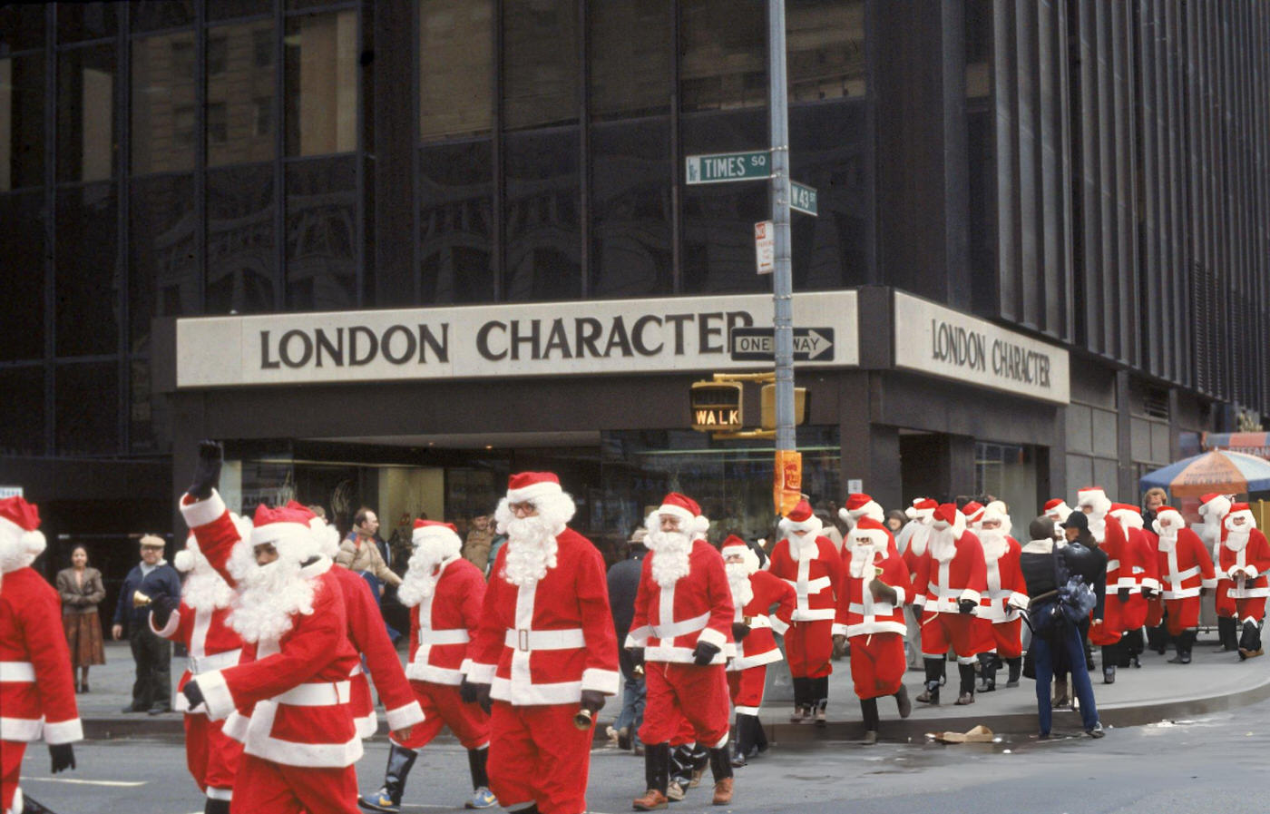 Men Dressed In Santa Claus Suits Cross The Street In Times Square, 1980S.