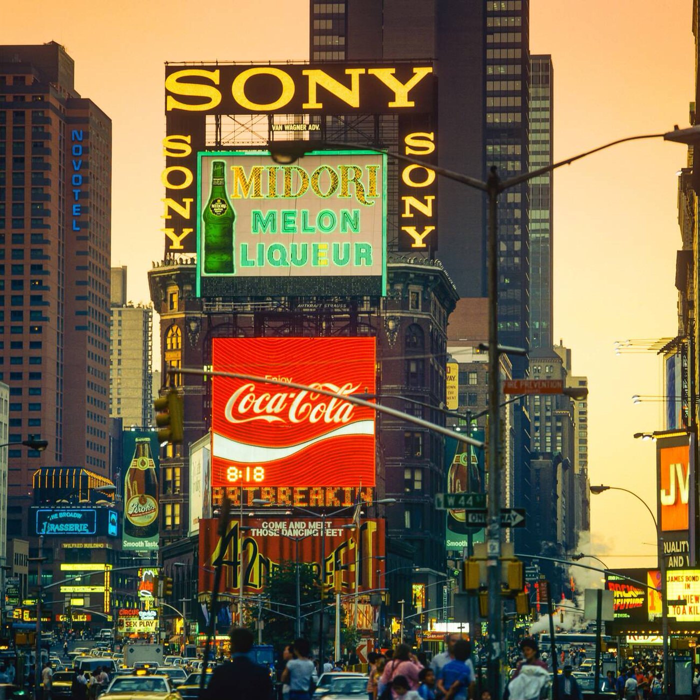 Times Square At Dusk, Illuminated Advertising Signs, Cars, People, Midtown Manhattan, July 1985.