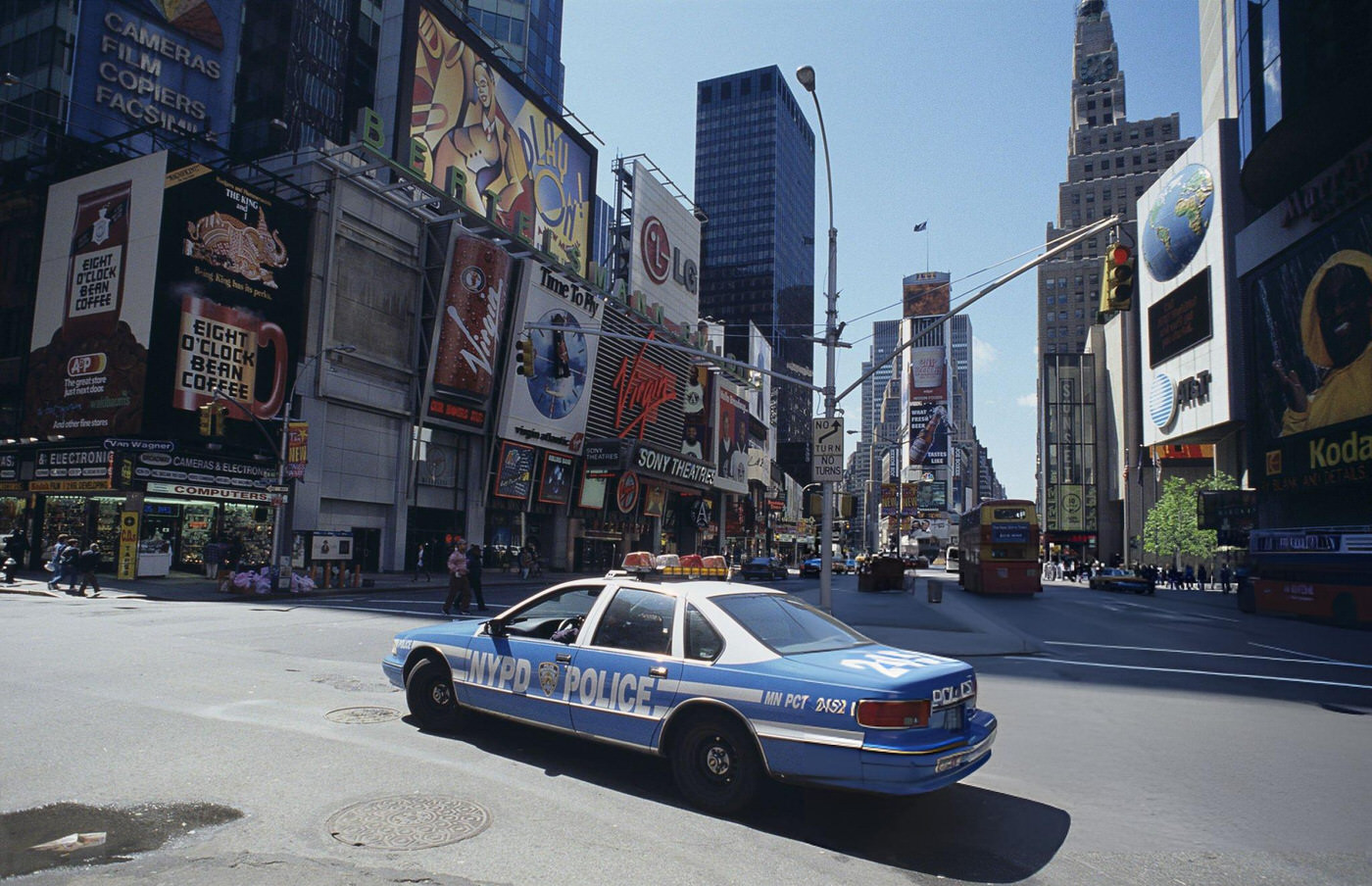 A New York City Police Department Car Crossing Times Square, New York, 1990S.
