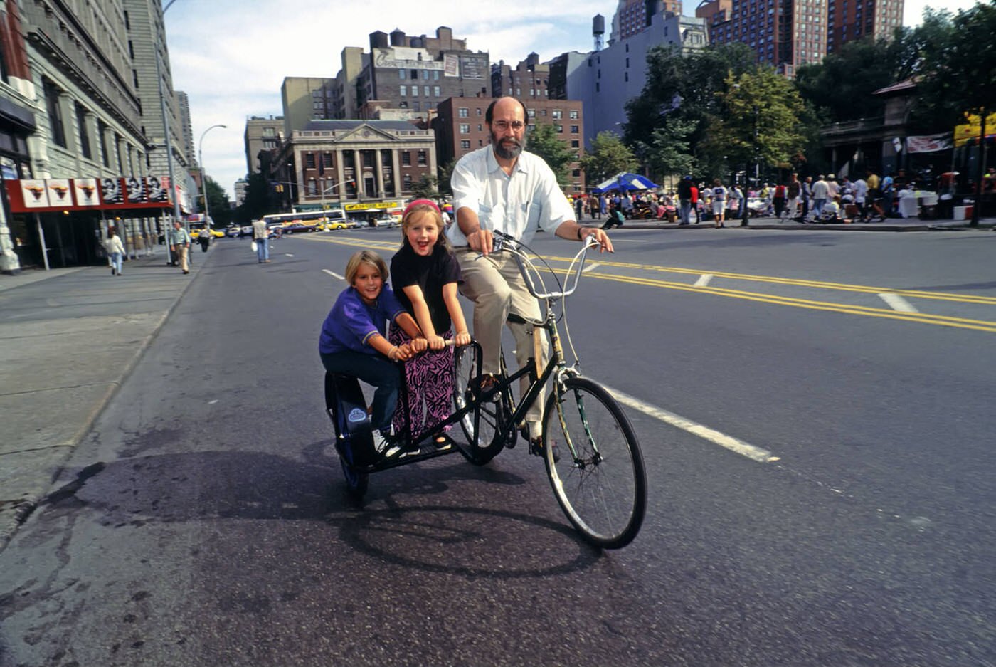 A Father Tests A Bicycle With Two Small Children In A Sidecar At An Alternative Cycling Festival In Union Square Park, August 26, 1992.