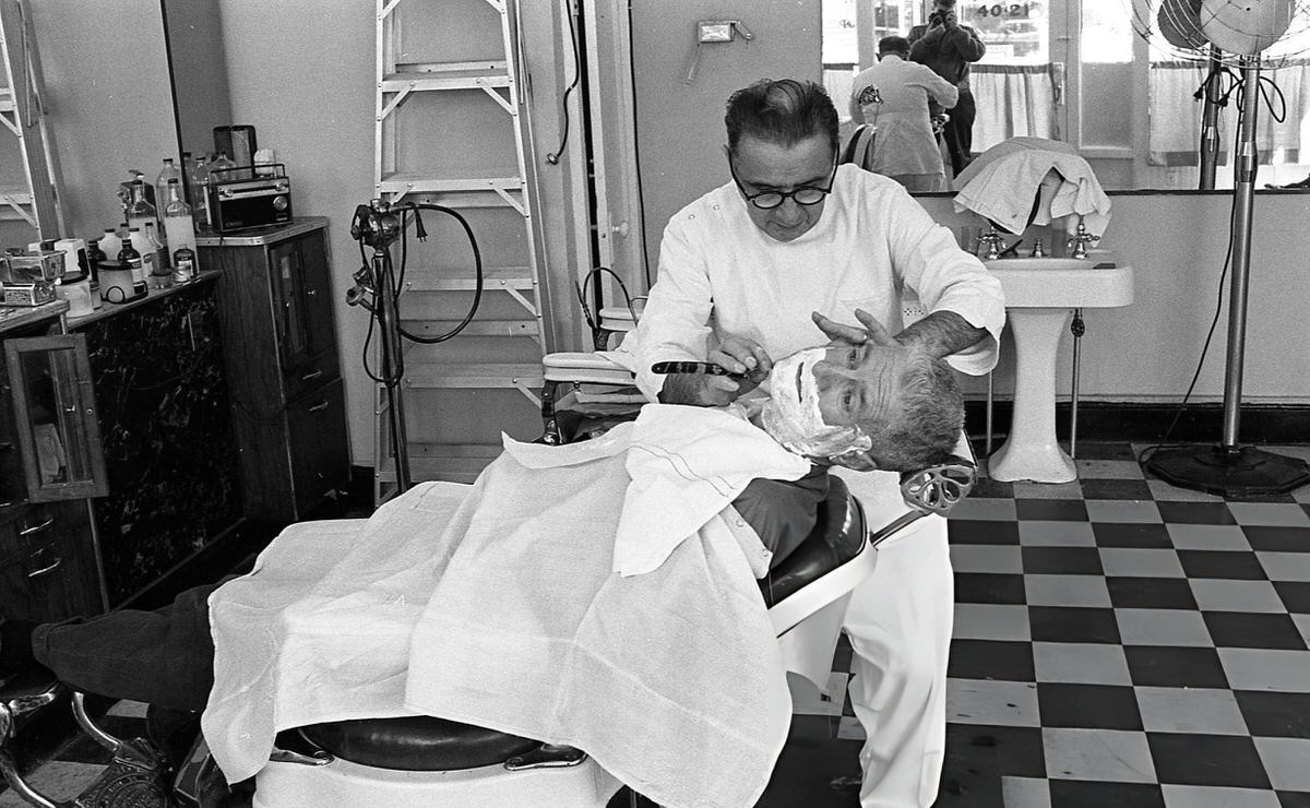 Barber Giving A Customer A Shave At A Shop On 108Th Street In Corona, Queens, 1970.
