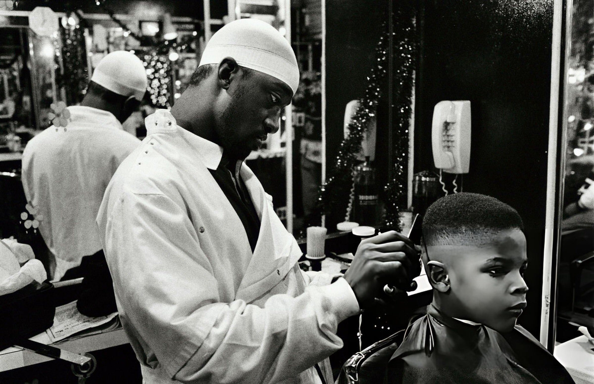 Barber Cutting A Child'S Hair In Harlem, New York.