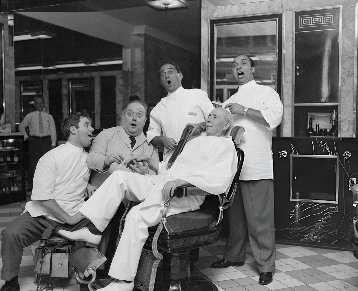 Metropolitan Opera Stars Serenading Barber Joseph Lamacchia At The Terminal Barber Shop In The Hotel Statler, New York, 1950S.