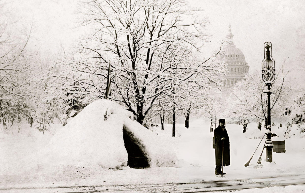 Man Standing By A Snow Hut With The U.s. Capitol In The Background After The Great Blizzard Of 1888.