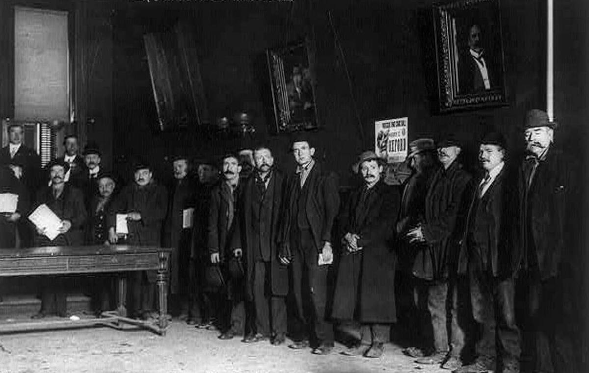 Men Waiting For Shoes Provided By Tim Sullivan In The Bowery, New York.