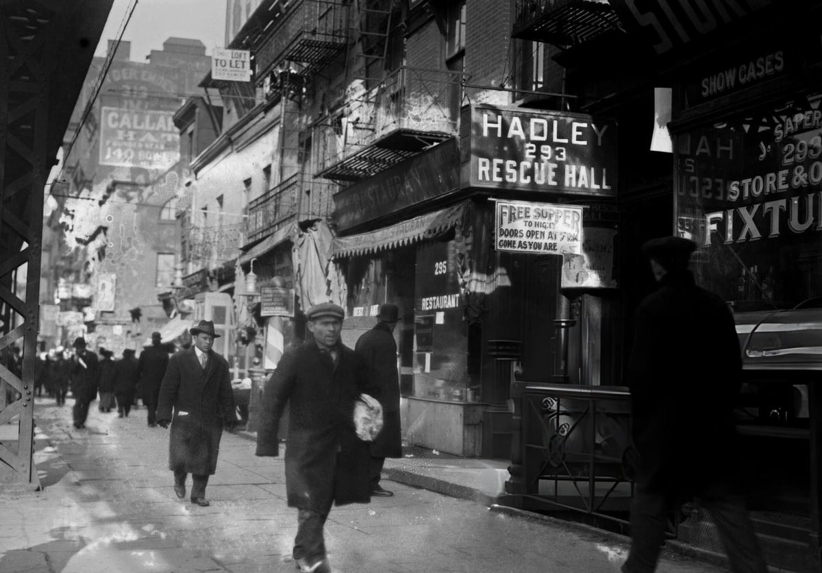 Men Walking On A Sidewalk In The Bowery, New York, 1910S.
