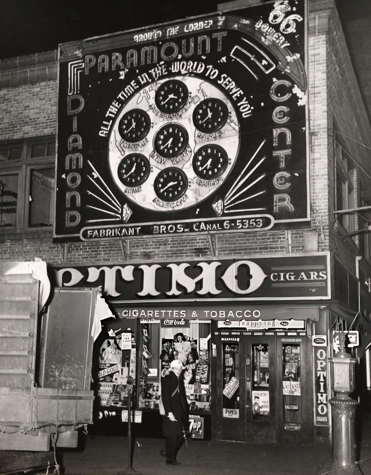 Civil Defense Worker On Patrol At Bowery And Canal Street Near A Tobacco Store, New York, 1944.