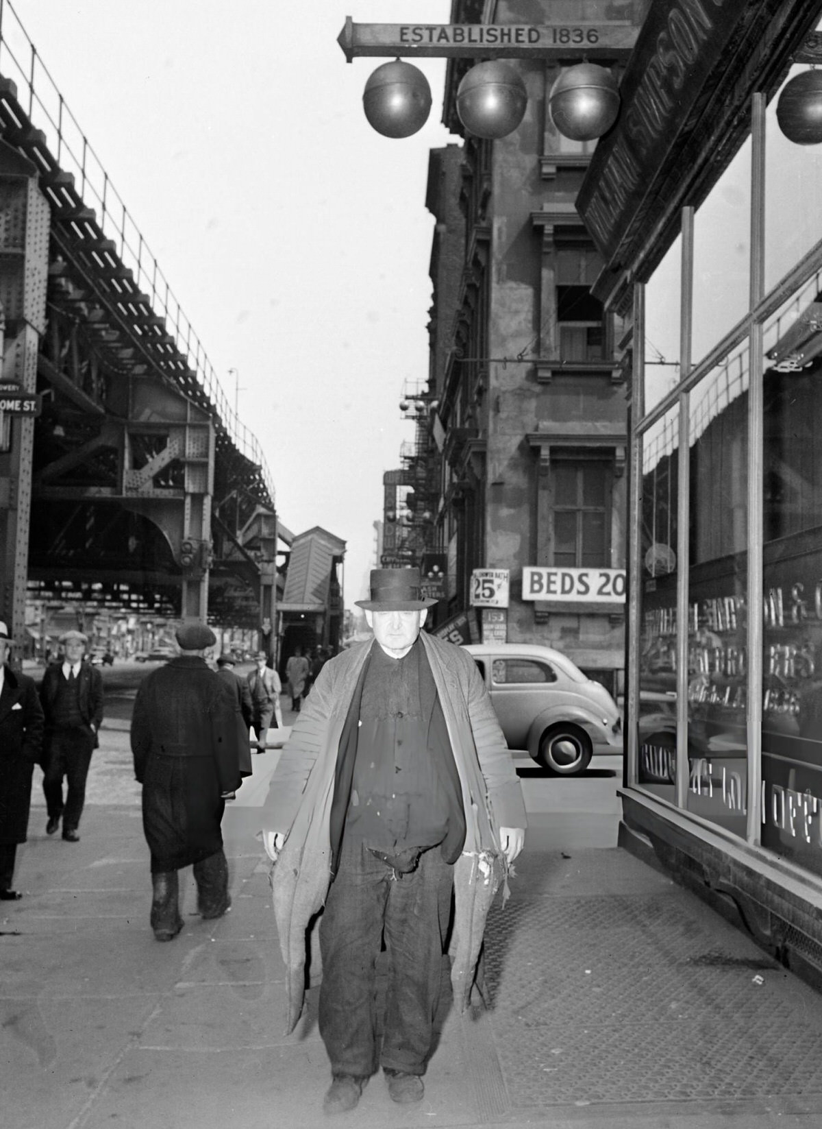 Man In Ragged Clothes Walking In The Bowery, New York, 1945.
