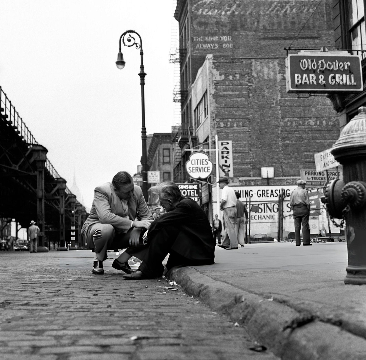 Man Speaking To A Homeless Person Outside The Bowery Mission, New York, 1945.