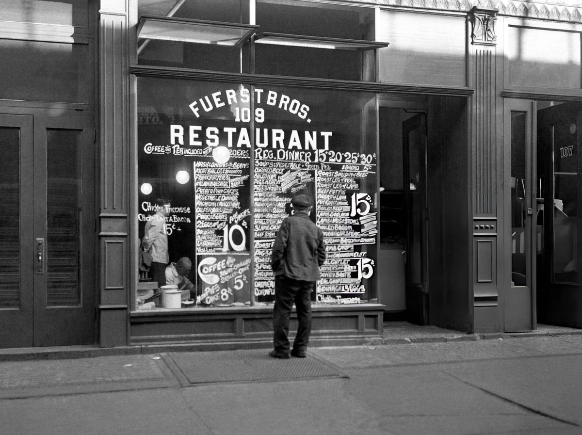 Man Reading A Menu In The Window Of Fuerst Bros. Restaurant On Bowery Street, New York, 1940S.