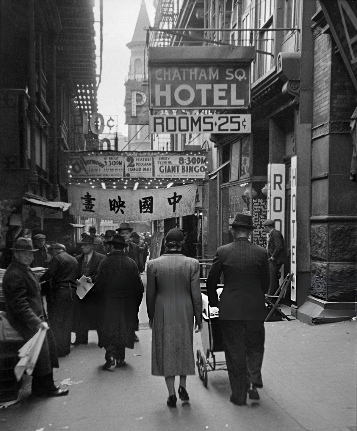 Pedestrians Passing Chinese Businesses And The Chatham Square Hotel In The Bowery, New York, 1940S.