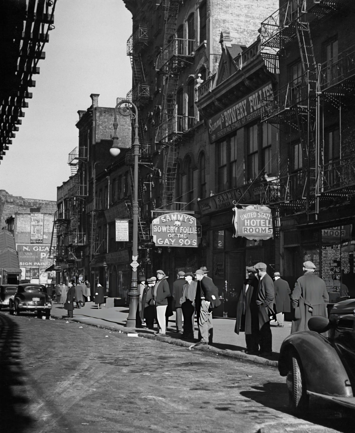 Pedestrians Outside Sammy'S Bowery Follies And The United States Hotel On The Bowery, Manhattan, 1940.