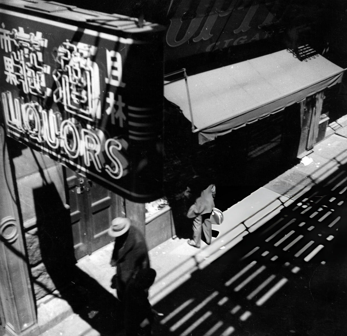 View From The Elevated Railway Of A Liquor Store At The Intersection Of The Bowery And Chinatown, 1949.