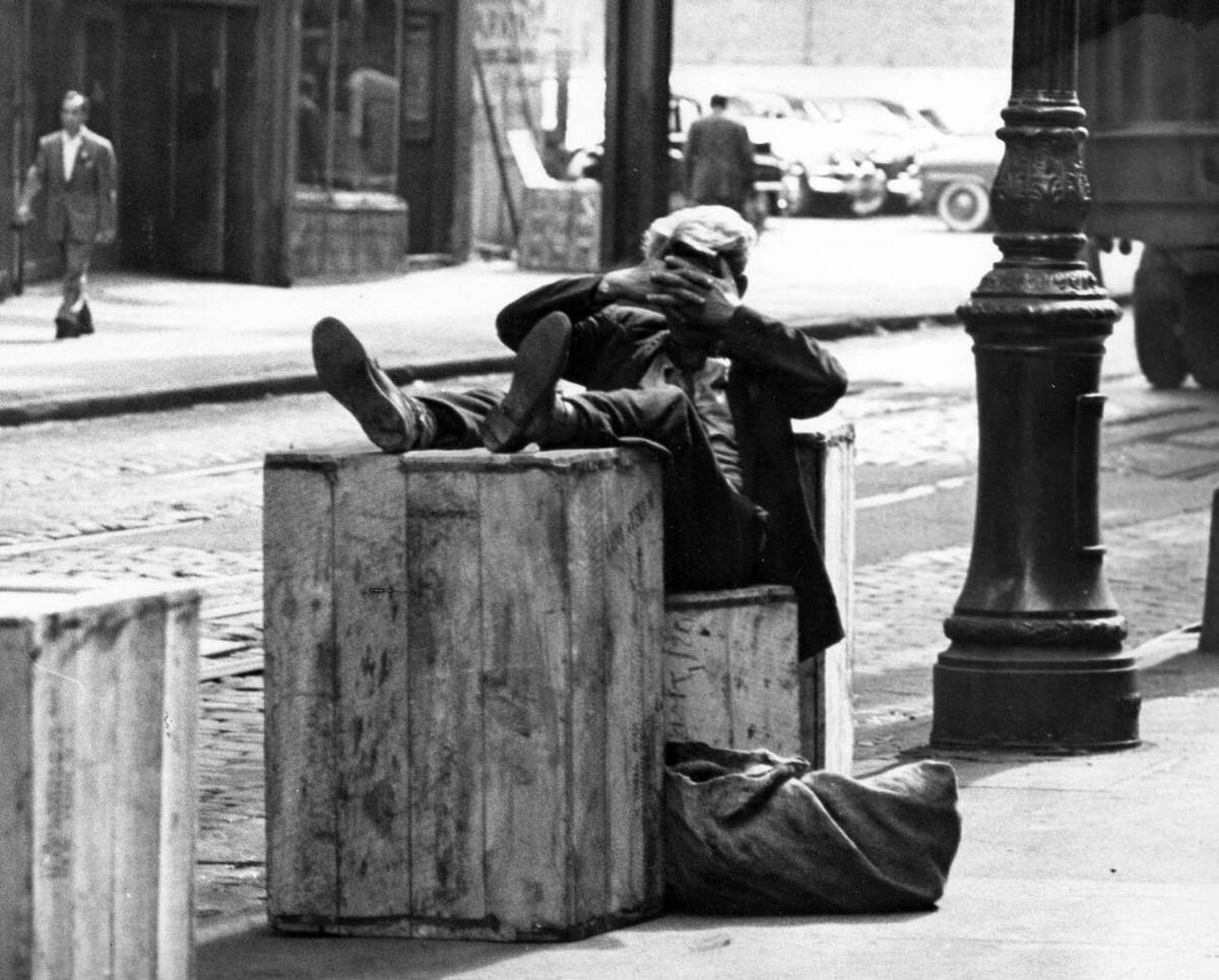 Man Relaxing On Wooden Crates In The Bowery District, New York, 1940S.