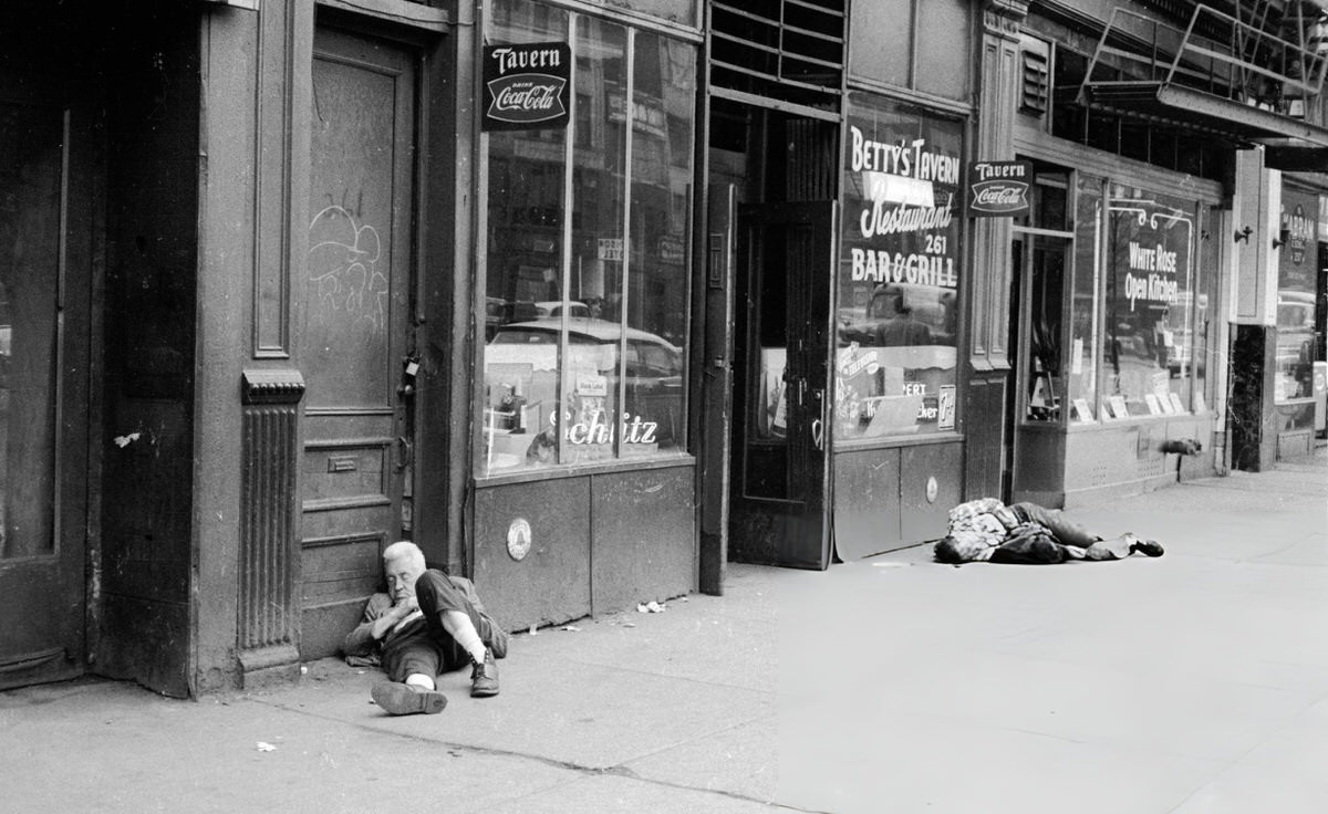Two Men Asleep On The Street Outside Betty'S Tavern On The Bowery, New York, 1961.