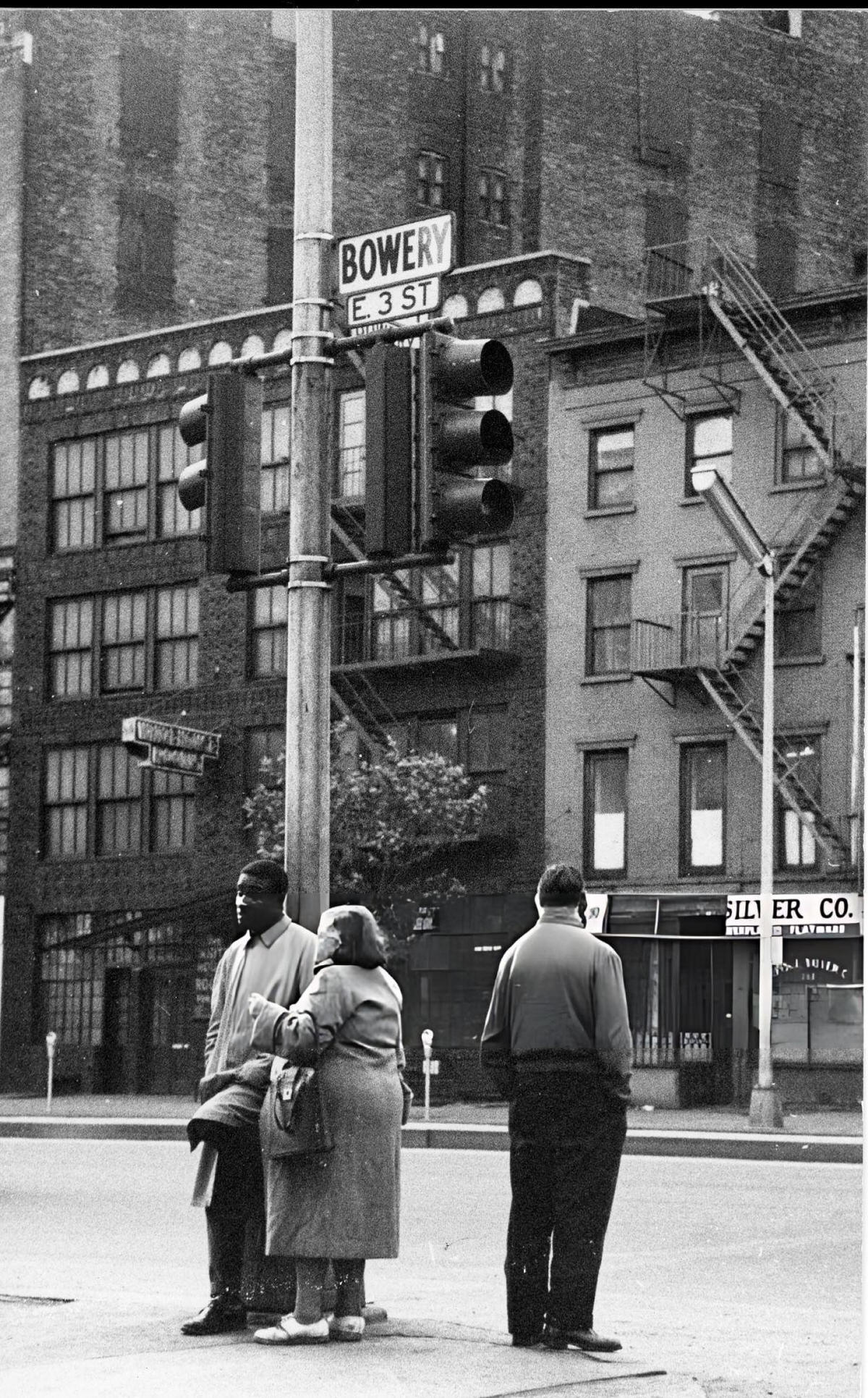 Group Of People On A Street Corner At The Bowery And East 3Rd Street, New York, 1960.