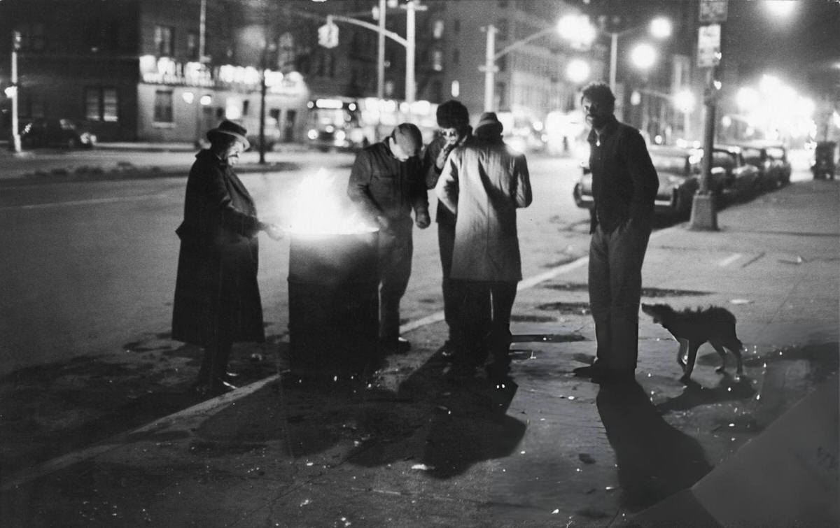 Homeless Men Gathered Around A Fire In An Oil Drum On The Bowery, New York, 1972.