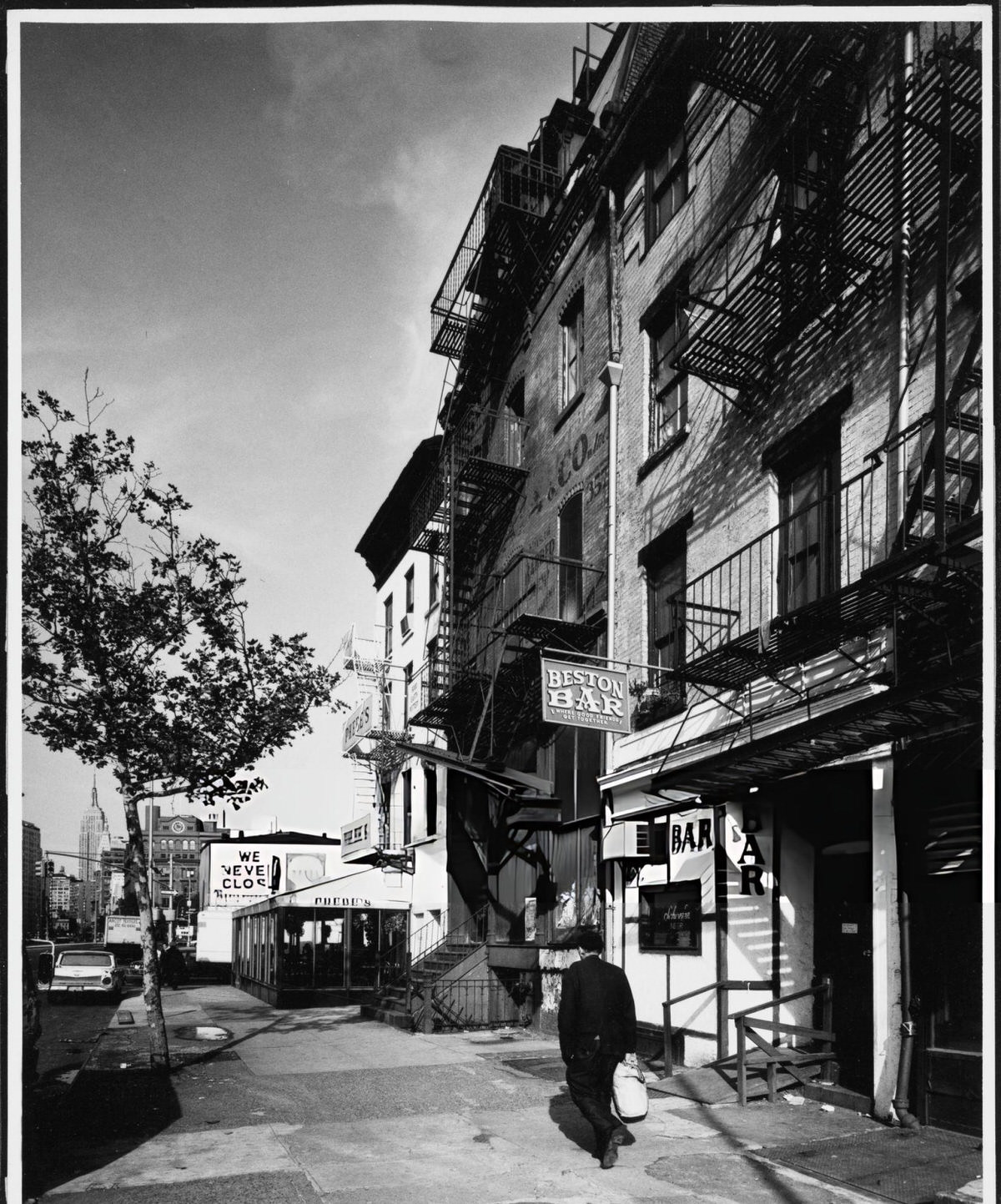 Man Walking Past Phebe'S And Beston Bar On The Bowery, New York, 1975.