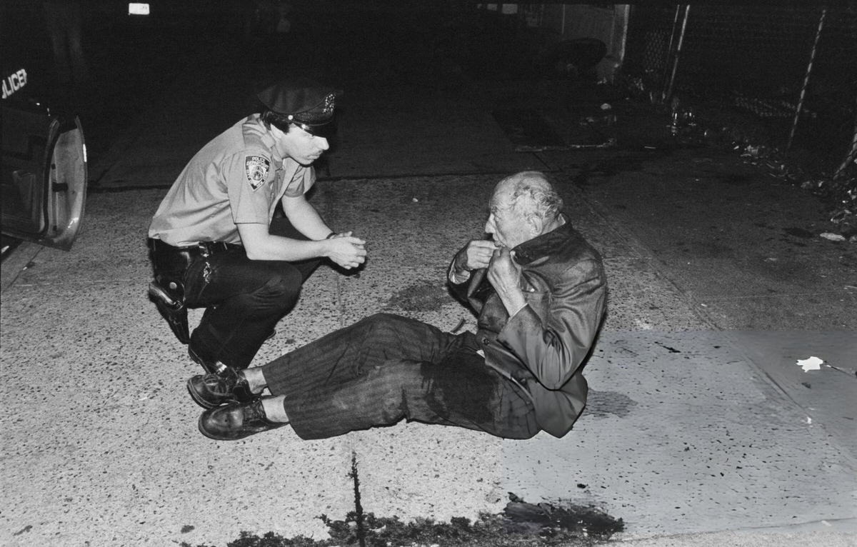 Police Officer Speaking To A Homeless Man On The Bowery, New York, 1978.