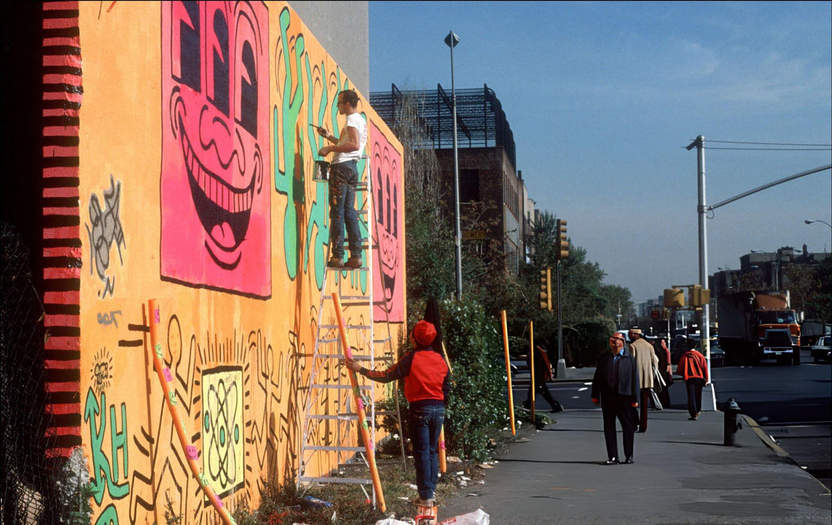 Keith Haring Painting A Mural At Houston Street And The Bowery, 1982.