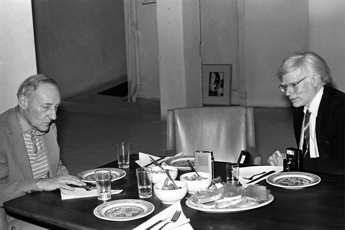 William S. Burroughs And Andy Warhol Dining Together At Burroughs' Home, &Amp;Quot;The Bunker,&Amp;Quot; On The Bowery, 1980.