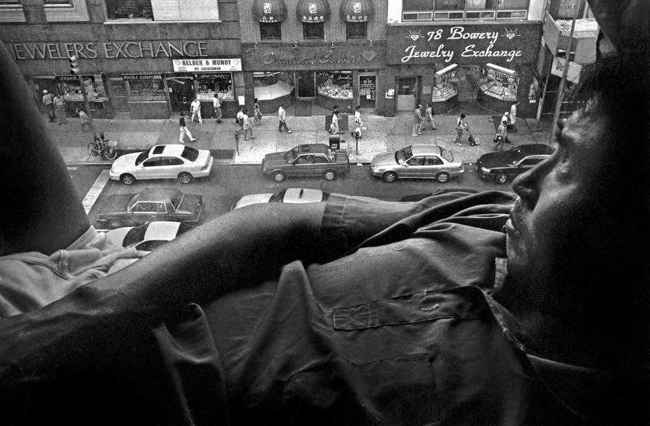 A Man At His Window, Looking Down At 78 Bowery, 1998.