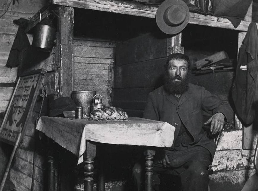 A Man Prepares To Celebrate The Sabbath On Ludlow Street, Circa 1890.