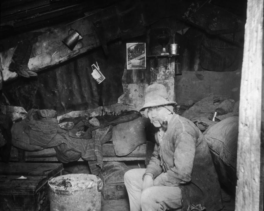 An Italian Immigrant Smokes A Pipe Beneath The Rivington Street Dump, Circa 1890.