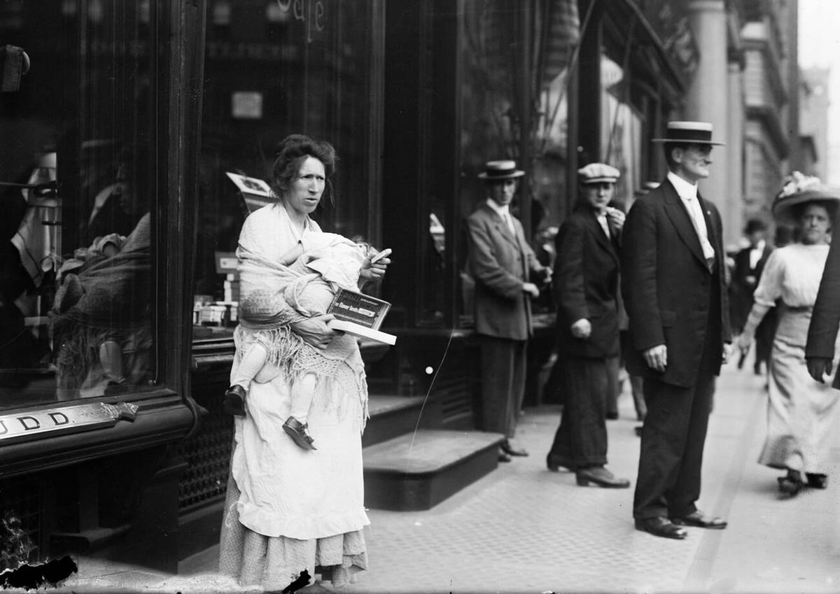 Woman With A Baby Selling Chewing Gum On Broadway, New York, 1913.