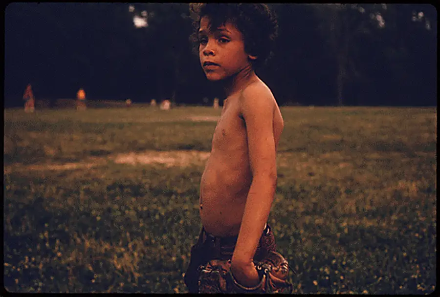 Puerto Rican Boy Playing Ball In Highland Park, Brooklyn.