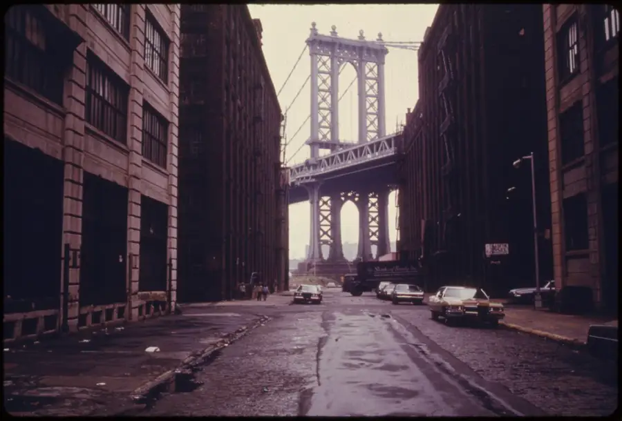 Manhattan Bridge Tower In Brooklyn, Framed Through Nearby Buildings.