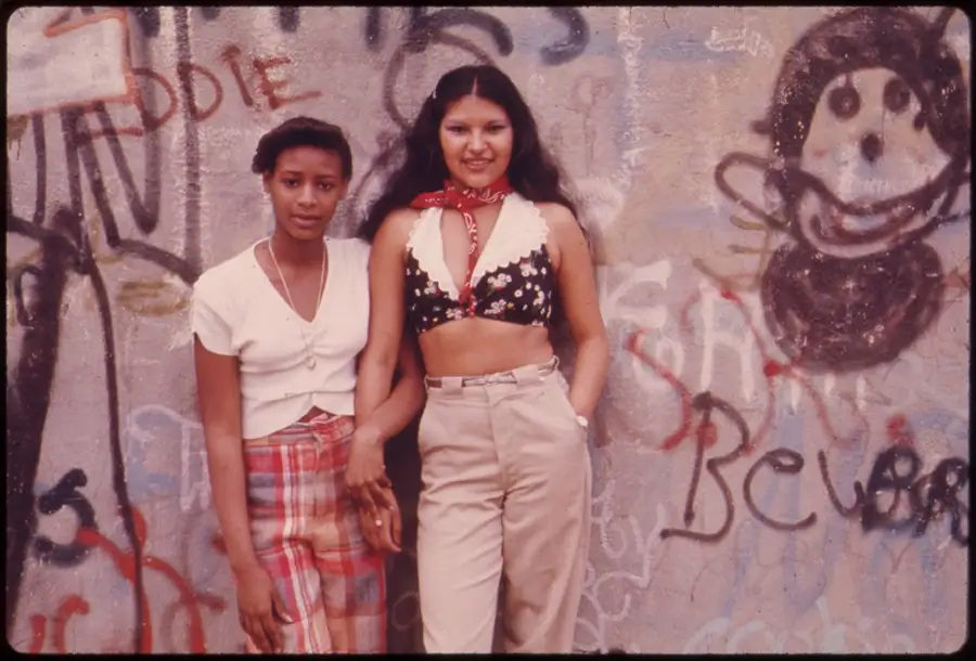 Two Latino Girls Pose In Front Of Graffiti In Lynch Park, Brooklyn.