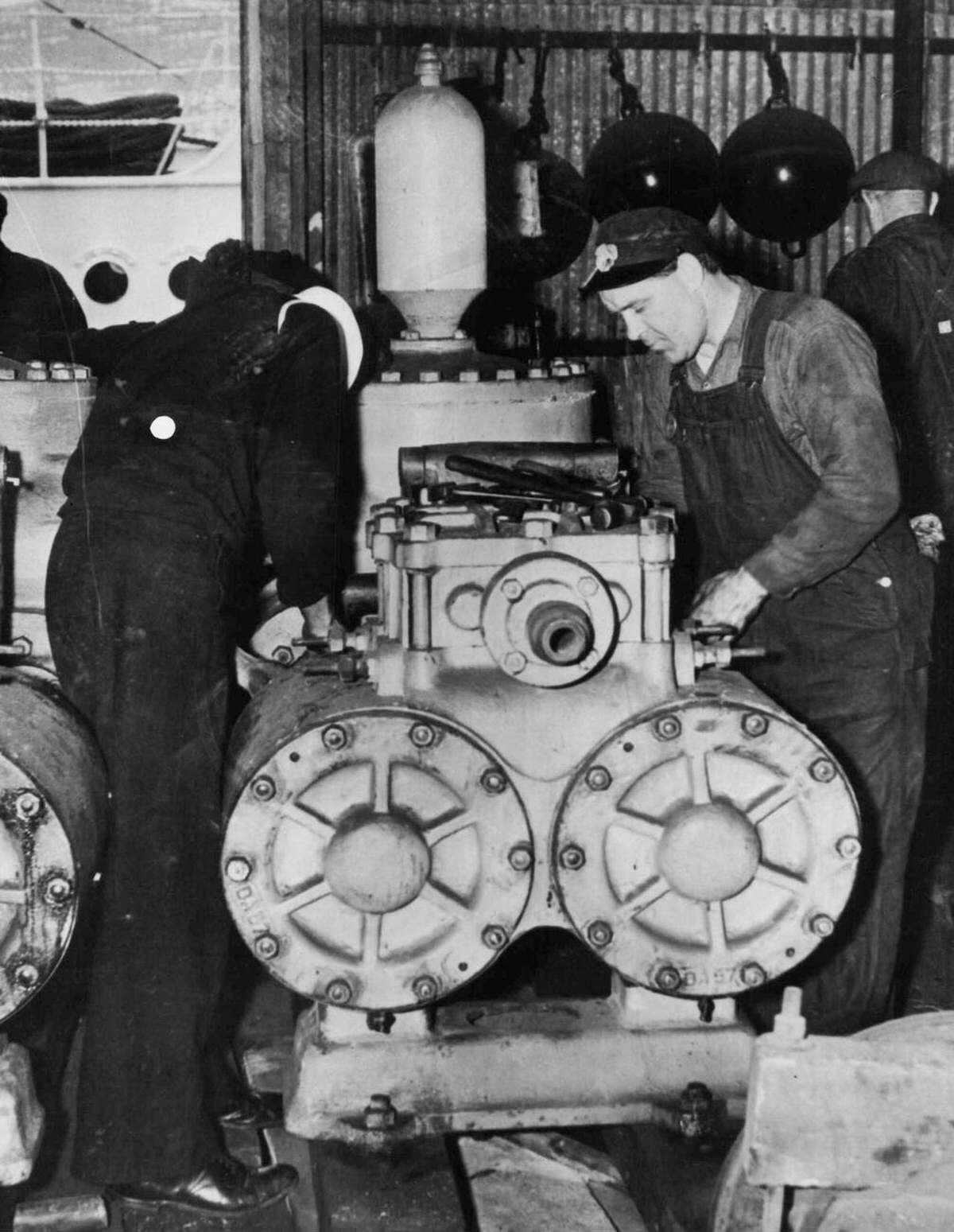 Mechanics Preparing Salvage Pumps For The Tug Sagamore At The Brooklyn Navy Yard, 1939.