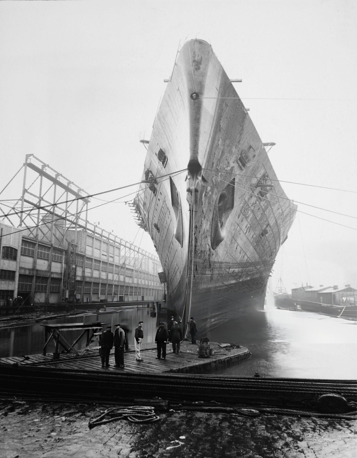 Shipyard Workers With The Righted Ss Normandie At Pier 88 Before Being Towed To The Brooklyn Navy Yard, 1943.